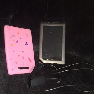 A used nook color with charger and case